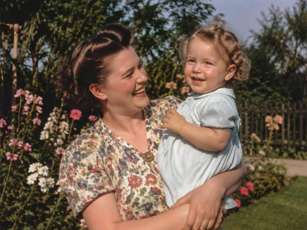 After: the same mother and child colourised by AI and animated into a short clip, with no one added to the picture