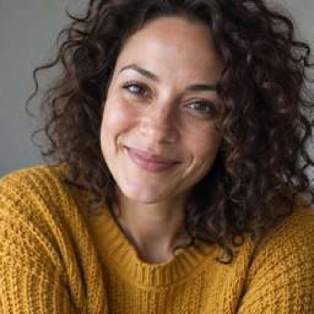 Before: low-resolution, pixelated portrait of a smiling woman with visible compression blocks